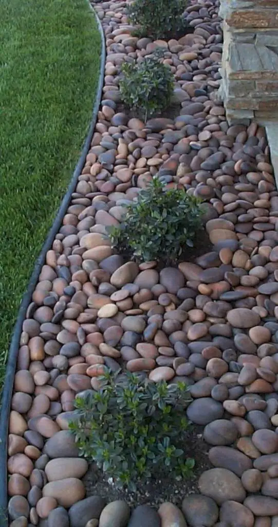 Stones around the Bushes - small backyard concrete ideas
